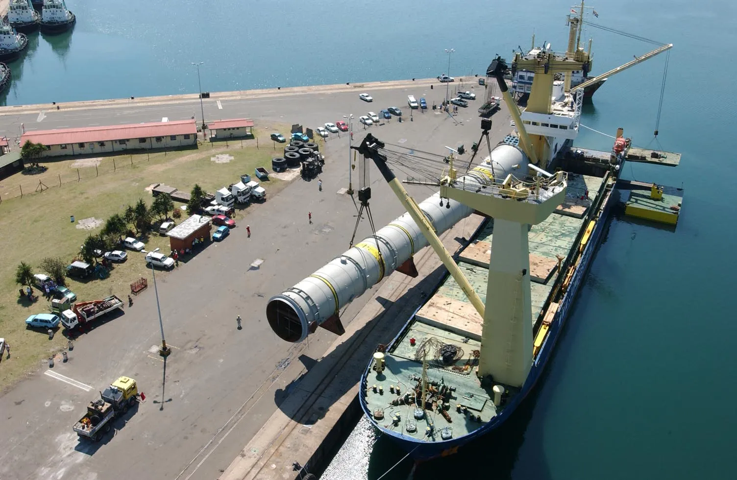 Industrial pipe being loaded on a vessel
