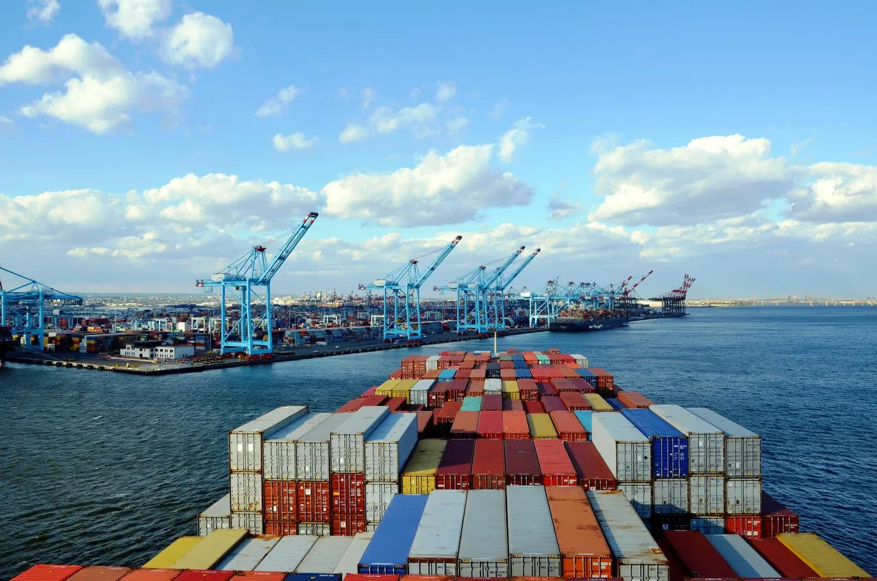 A view of a container yard from a loaded container ship entering it.