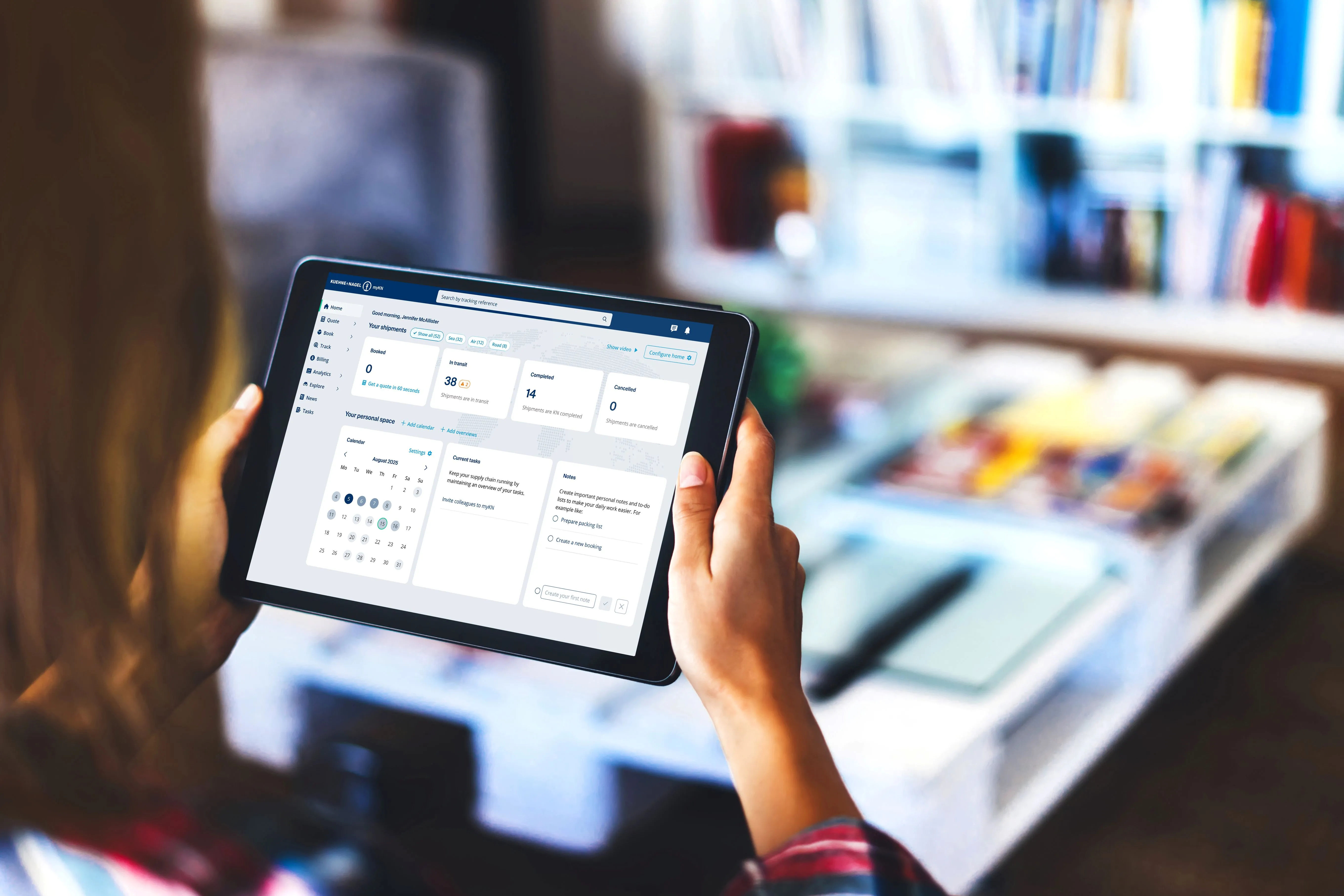 A user holds a tablet with myKN visible interface featuring sections showing scheduling and task management tools